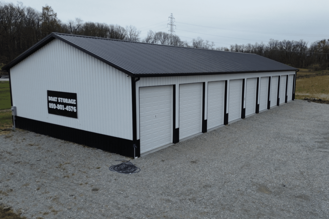 left white and black 40x104 garage with nine garages in Sardinia oh used for boat storage