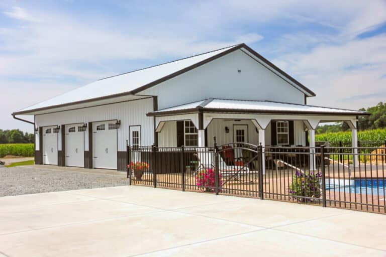 white and black trimmed pole barn garage by pool in Ohio