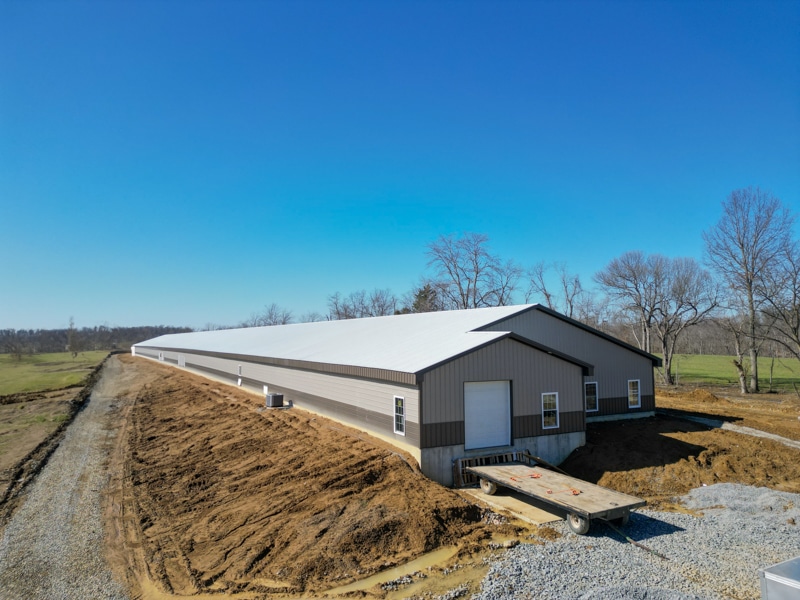 white, tan, and gray 56x656 large commercial pole barn