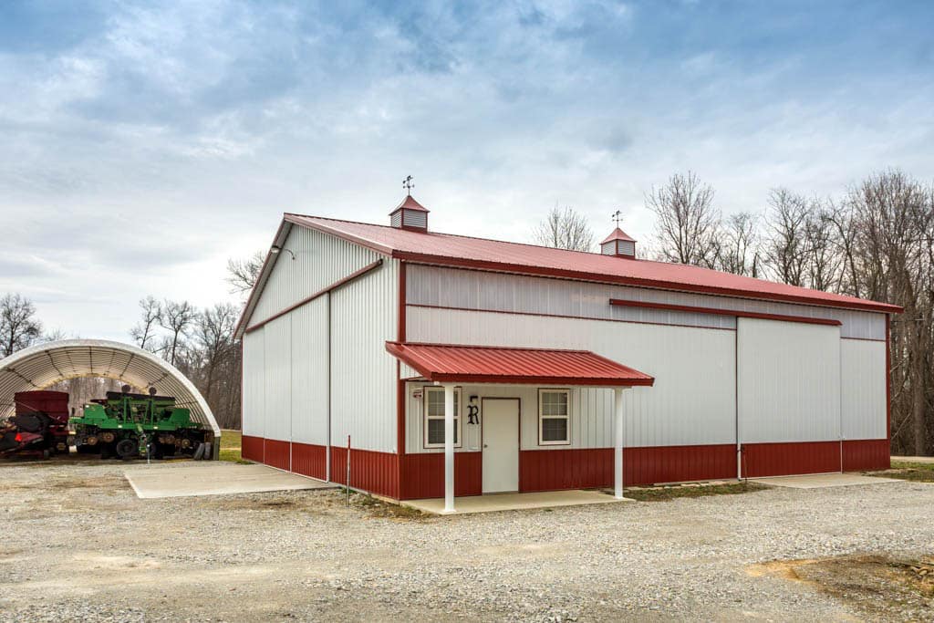 white and red trimmed 24x32 agricultural pole barn