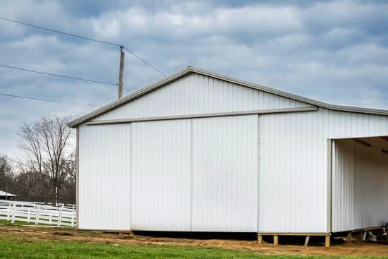 white metal siding panels on pole barn