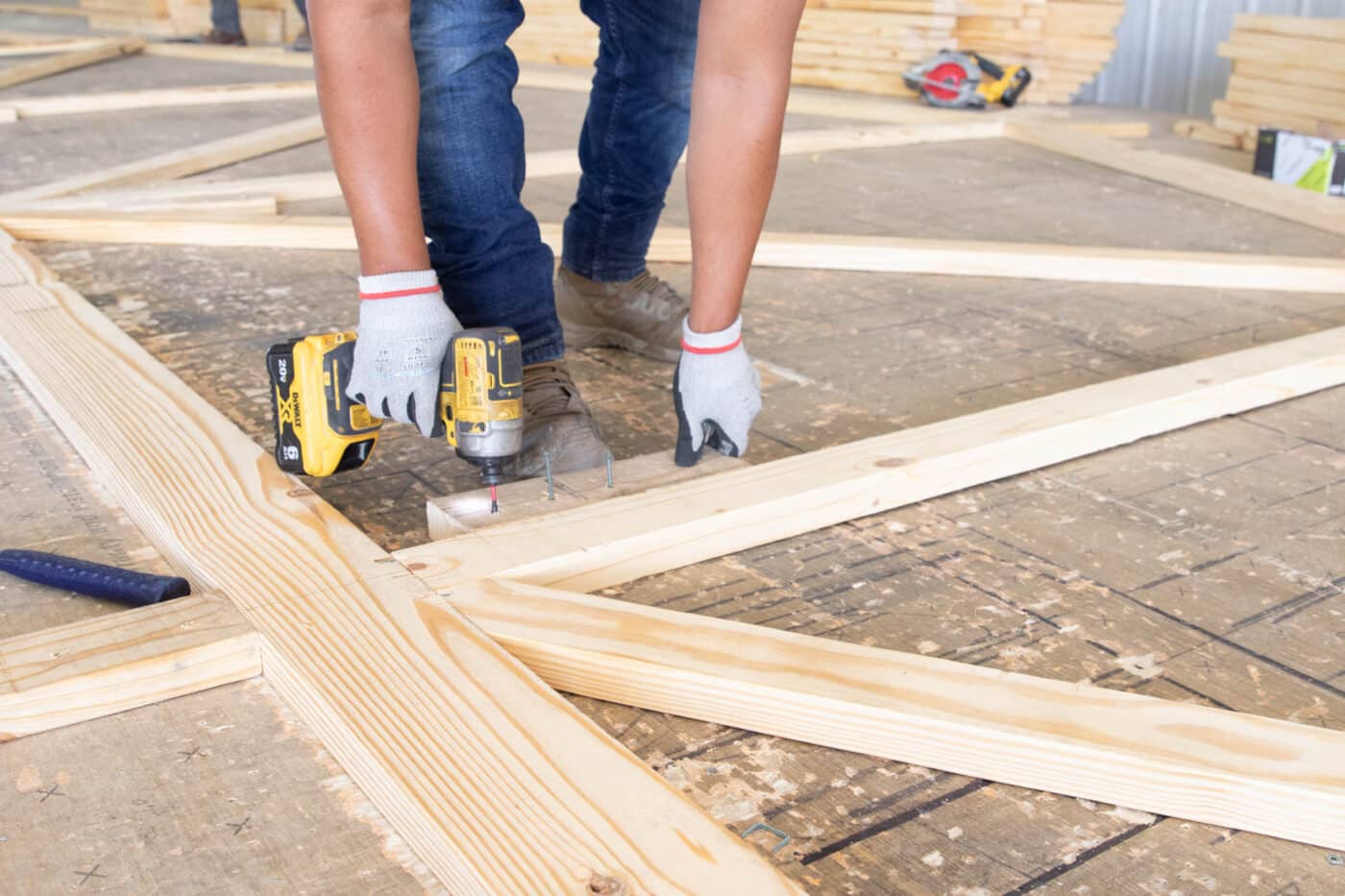 wooden roof trusses being assembled