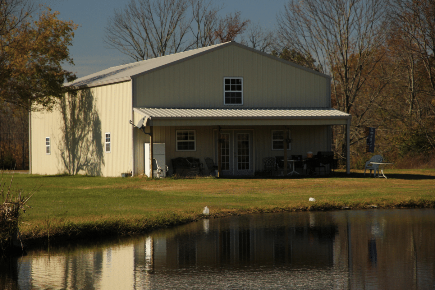 yellow 100x100 barndominium near water